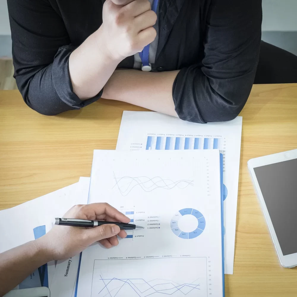 business-adviser-analyzing-financial-figures-denoting-progress-work-company